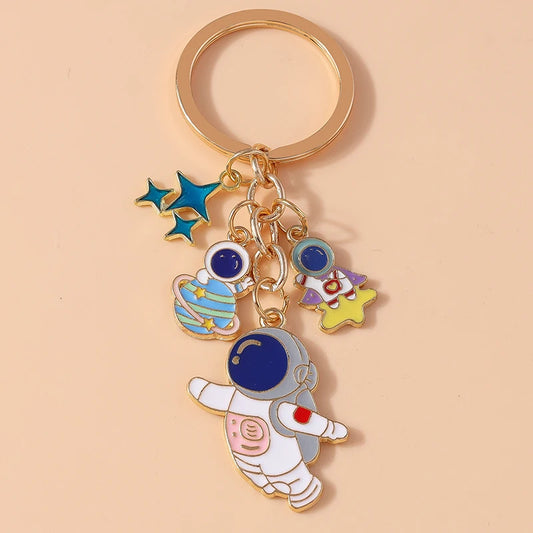 Cute Cartoon Astronaut Keychain – Enamel Rocket Pendant for Women & Girls